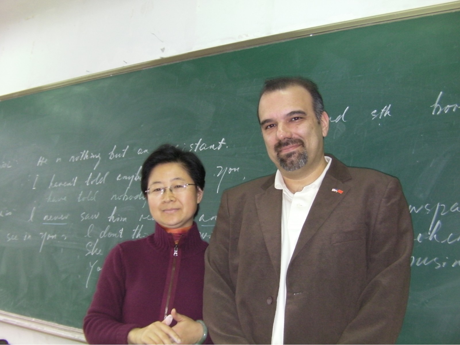 Dave Williams with an educator in a classroom during professional travel in China.